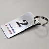 brelok-srebrny-jednostronny-laminat-nadruk-logo-z-numeracja-metalowe-kolko-zawieszka-do-kluczy-MAYA