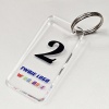 brelok-z-nadrukiem-UV-logo-w-kolorze-plexi-bezbarwna-z-numeracja-MAYA